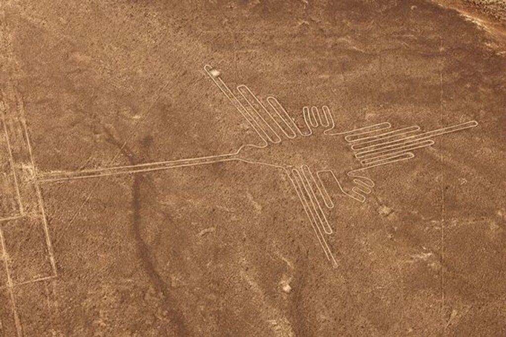 Peru Inca adventure tour 17 days — Nazca Lines hummingbird geoglyph aerial view from Cusco