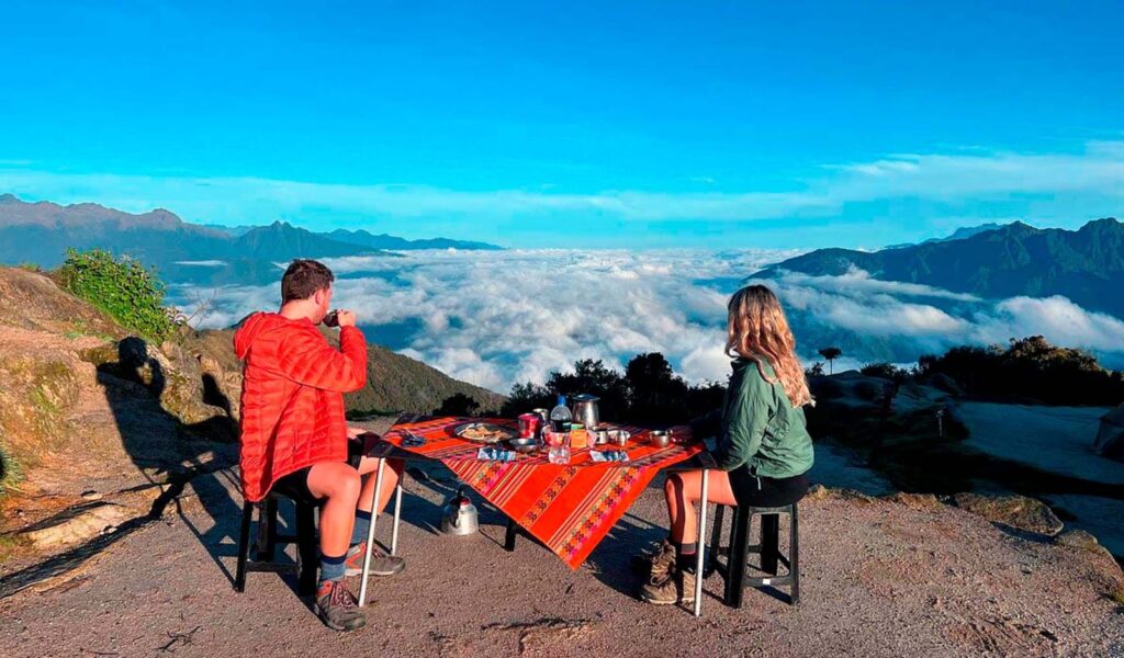 Machu Picchu tour 4 days via Classic Inca Trail — mountain viewpoint above clouds