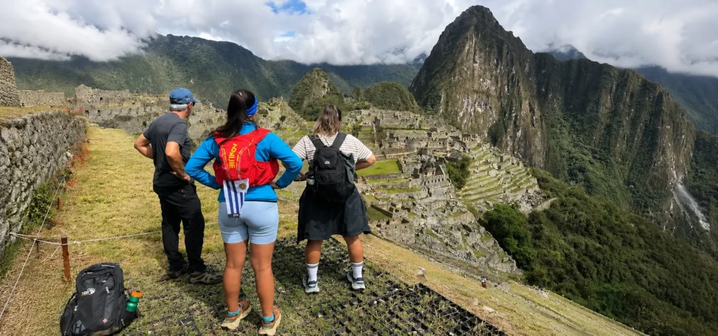 Hikers overlooking Machu Picchu and Huayna Picchu
