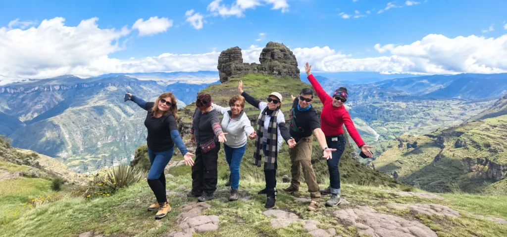 Callanga Family Explorers expert guide with a small group on the Waqrapukara Cusco day tour