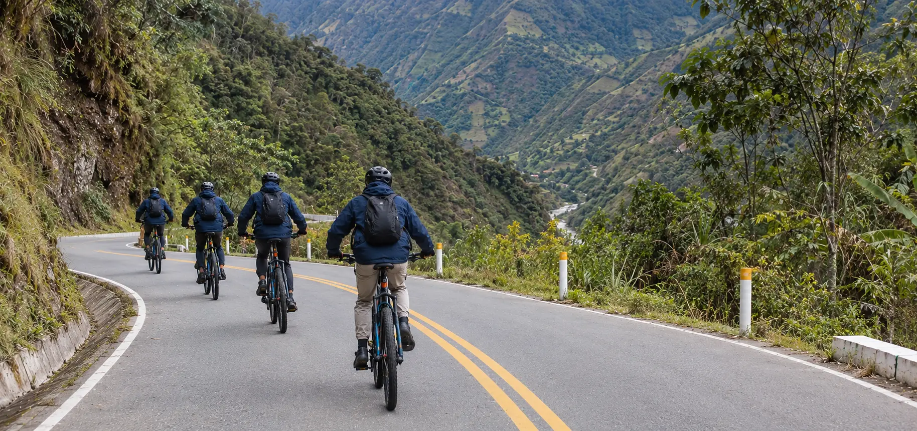 Inca Jungle Trek 4 days - mountain biker descending from Abra Málaga at 4,300 m (14,108 ft) toward the jungle
